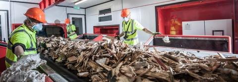 Wood waste being picked for recycling