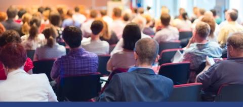 People sitting in a large room