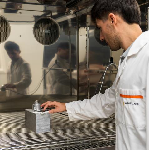 Man in lab coat standing in laboratory