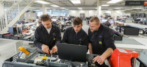 People with electronics parts