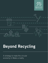 Strategy's front page in dark with publisher's logo, some graphical drawings and lines and words "Beyond Recycling - A strategy to make the circular economy in Wales a reality"