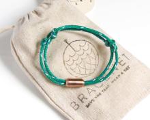 A bracelet on a cotton bag with the 'Bracenet' on it