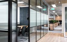 Glass-fronted meeting room with furniture