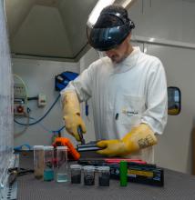 Man in lab coat standing in laboratory