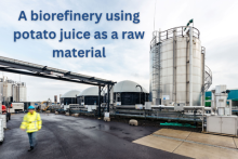 A photo of a biorefinery with a person walking in front of it, and the words ' A biorefinery using potato juice as a raw material'