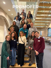  A group of people assembled on the stairs, within the logo PROMOFER at the top of the photo