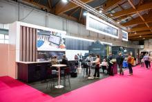 Stands with machinery and people walking around